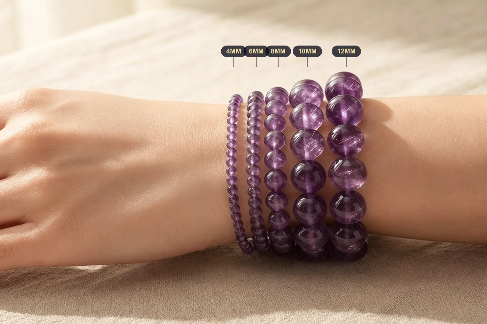 Amethyst bracelets in 4mm 6mm 8mm 10mm and 12mm bead sizes compared on one wrist